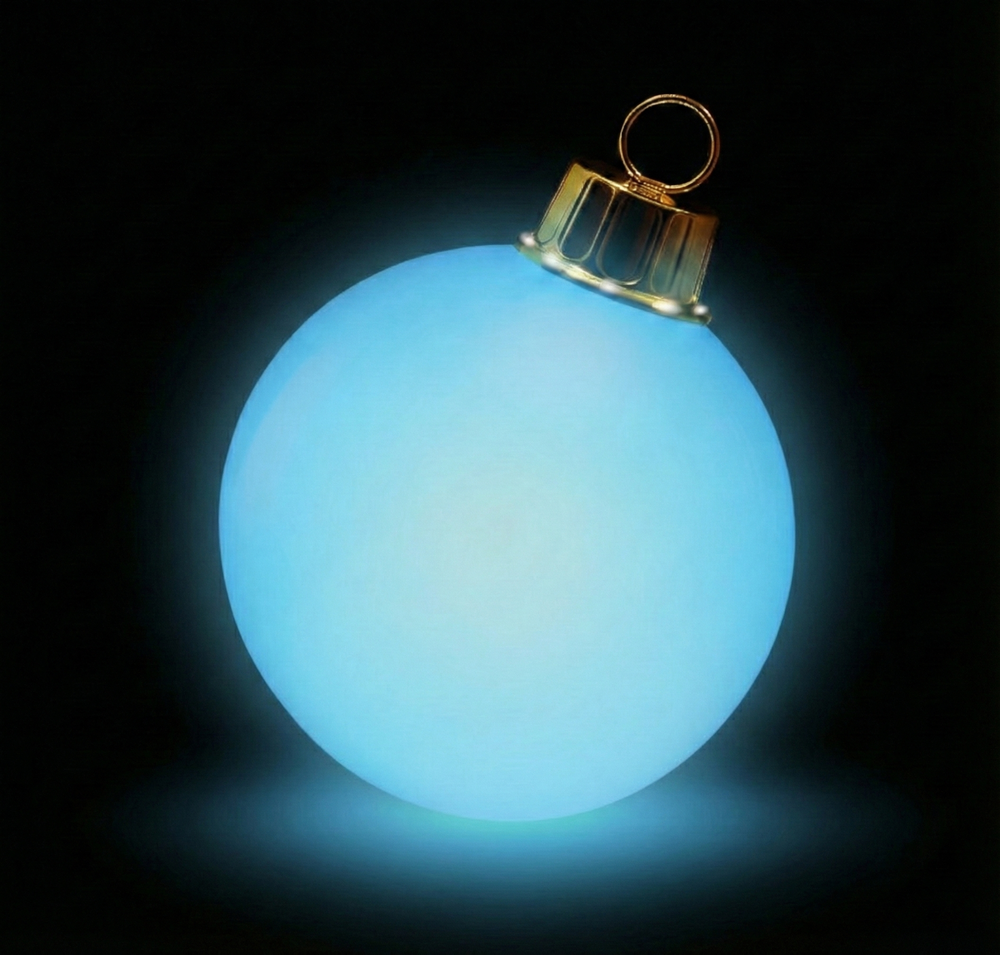 Glowing blue Christmas ornament on a black background